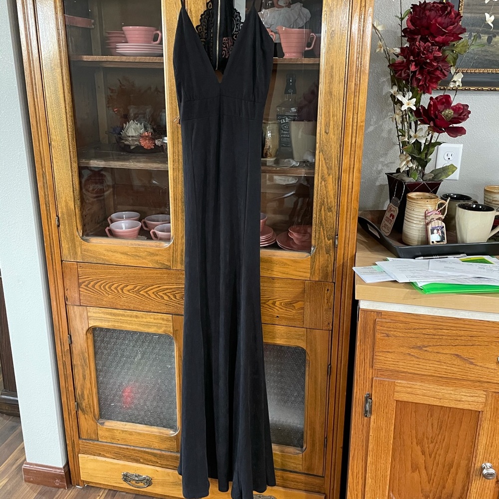Black long dress with lace detail.